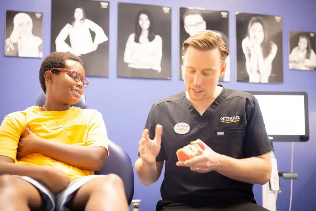 Orthodontist performing dental examination at Petrous Orthodontics in Royal Oak, MI